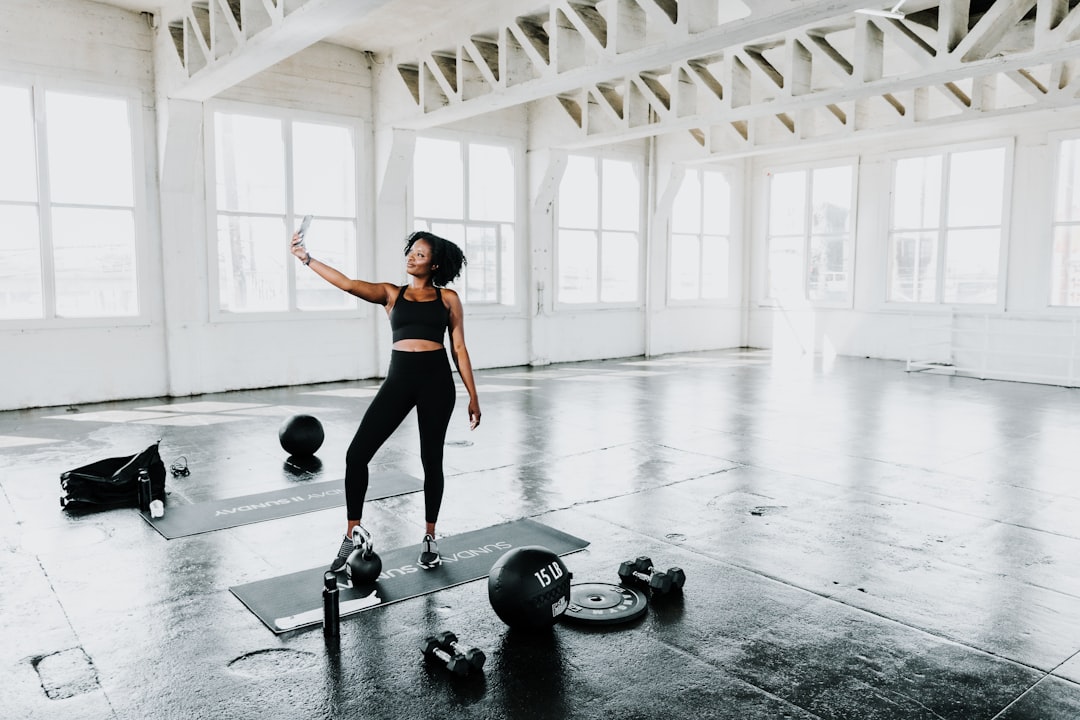 a-woman-is-doing-exercises-in-a-gym-fqnaadxn6i4