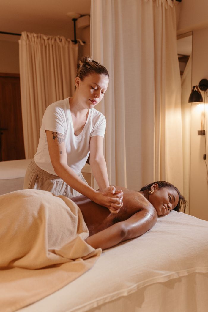 contact-img A professional massage therapist providing a calming spa treatment in a serene environment.